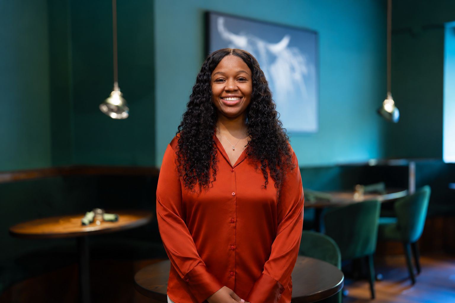 Deja Torrance, manager, smiling in the dining room